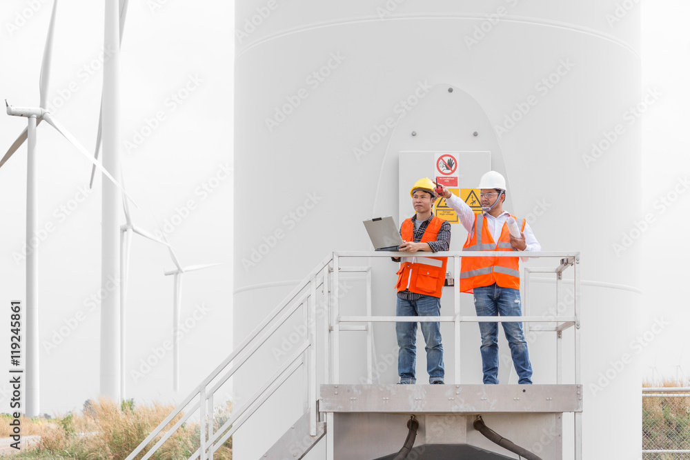 Engineers and technician working in wind turbine station StockFoto