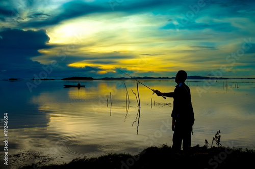 Beautiful sky and Silhouettes of fisherman.
