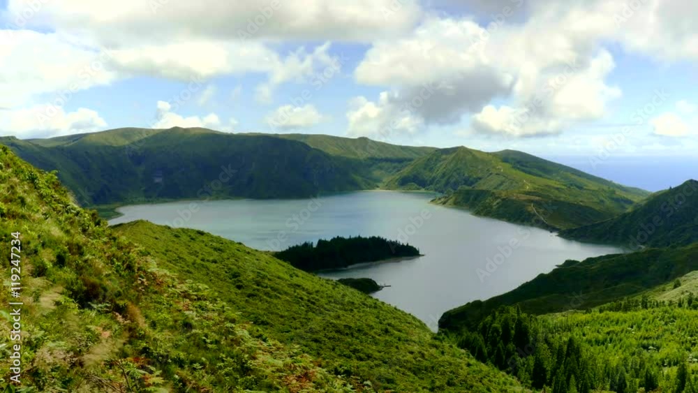 4k time lapse landscape video of lake of fire Lagoa da Fogo in Sao Miguel island Azores Portugal with clouds on blue sky moving fast projecting shadows on lagoon view in timelapse travel destination 4k time lapse landscape video of lake of fire Lagoa da Fogo in Sao Miguel island Azores Portugal with clouds on blue sky moving fast projecting shadows on lagoon view in timelapse travel destination