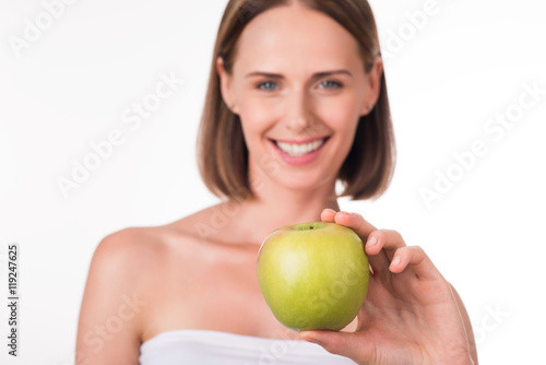 Nice young woman with apple