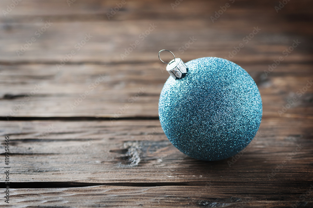 Blue christmas balls on the wooden table