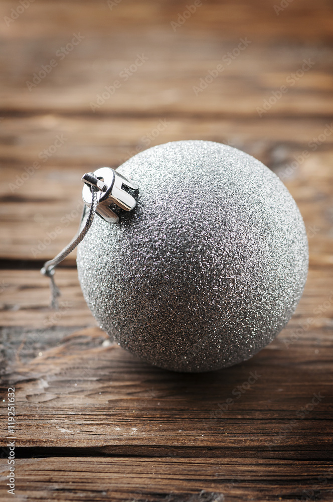 Silver ball for christmas on the wooden table