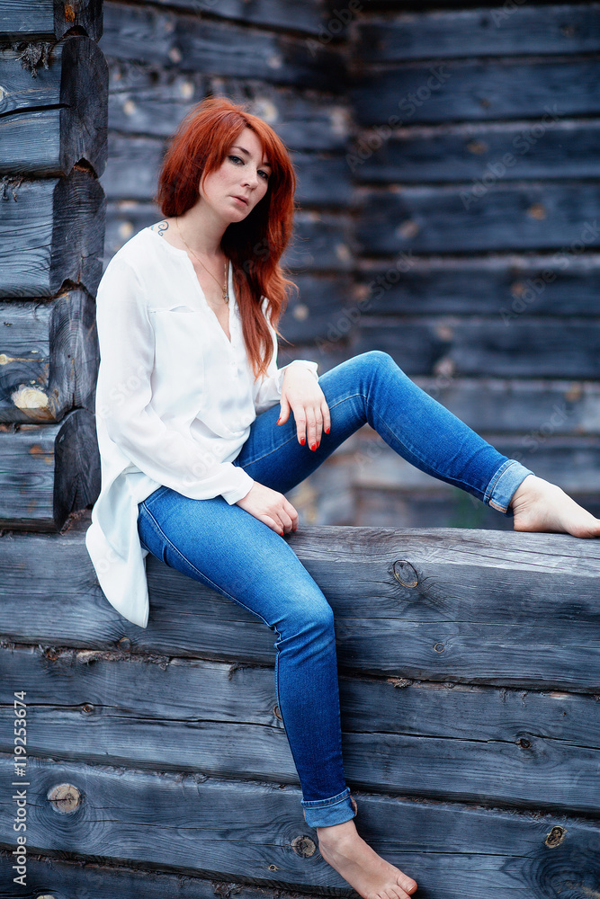 Girl in white shirt and blue jeans Girl in white shirt and blue jeans