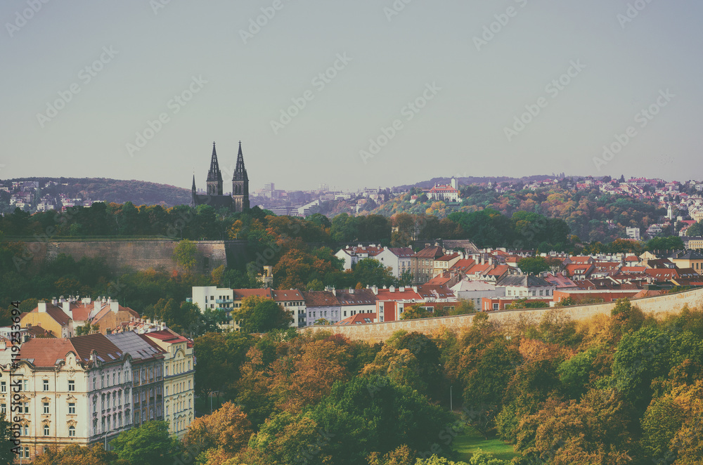 View to the Vysegrad in Prague, Czech Republic at autumn with cathedral and red roofs, travel seasonal vintage hipster background