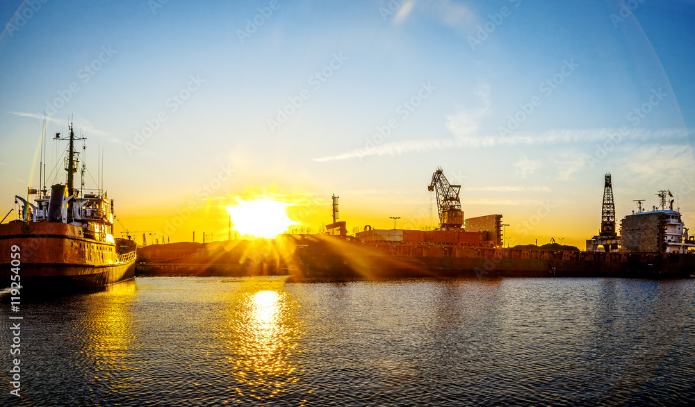 Ship at sunset in shipyard of Gdansk, Poland. Ship at sunset in shipyard of Gdansk, Poland.