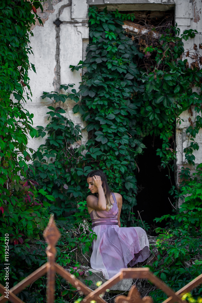 beautiful girl in dress on the background of wild grapes beautiful girl in dress on the background of wild grapes