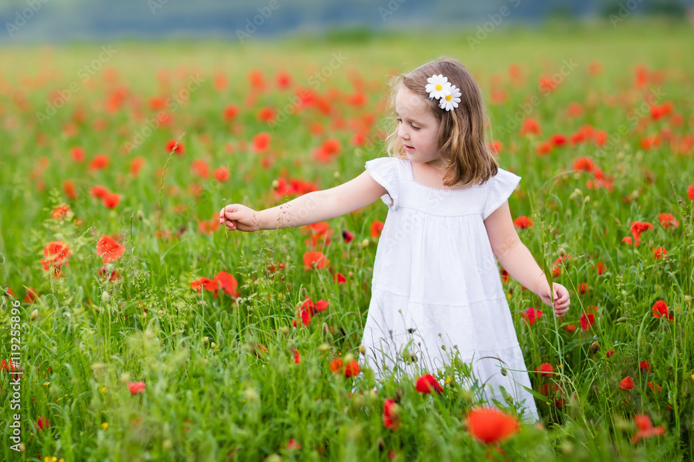 Little girl in poppy flower field Little girl in poppy flower field