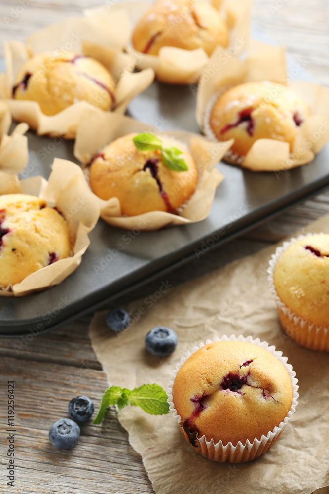 Muffins with blueberries on grey wooden table Muffins with blueberries on grey wooden table
