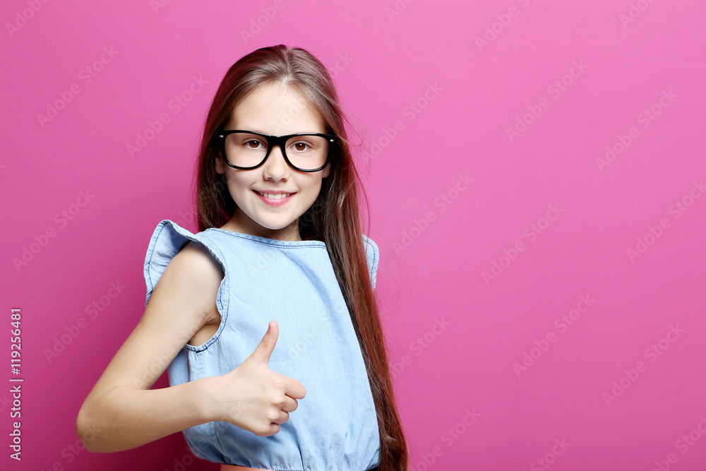 Portrait of young girl on the pink background Portrait of young girl on the pink background
