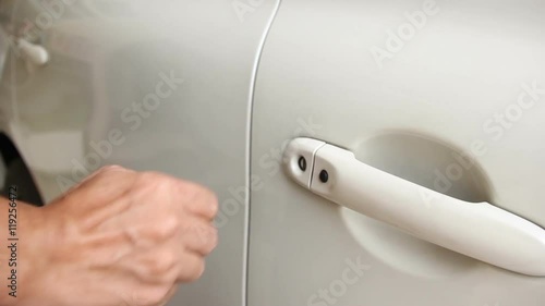 Asian Man Hand Using Key To Unlock And Open Cars Door
