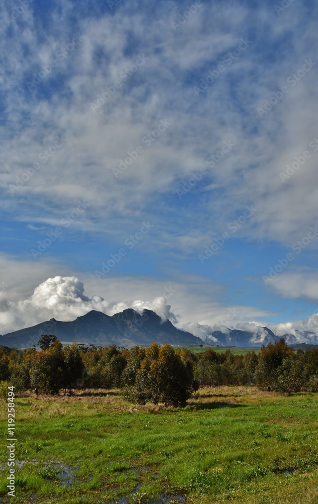 Landscape with the Hottentots Holland Mountains and withe clouds in the sky