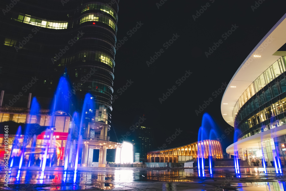 Modern Plaza and Colorful Fountains by Night
