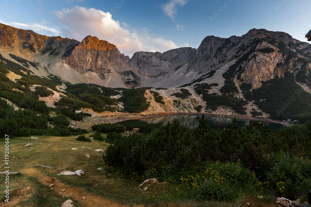 Sunset with Colored in red rock near Sinanitsa peak and the lake, Pirin Mountain, Bulgaria Sunset with Colored in red rock near Sinanitsa peak and the lake, Pirin Mountain, Bulgaria