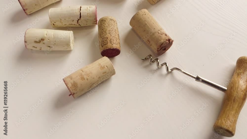 The camera moves along the wine corks and corkscrews The camera moves along the wine corks and corkscrews