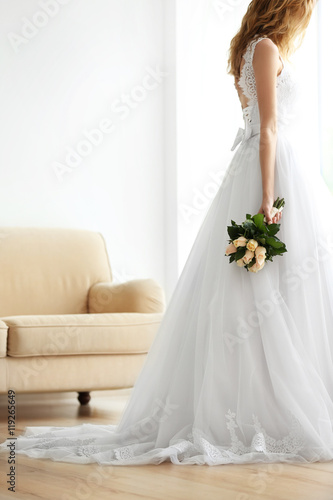 Bride in beautiful dress ho...
