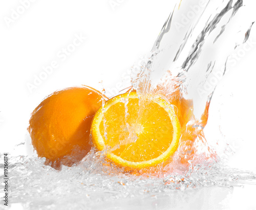 Fototapeta Naklejka Na Ścianę i Meble -  Fresh oranges in splashing water isolated on white