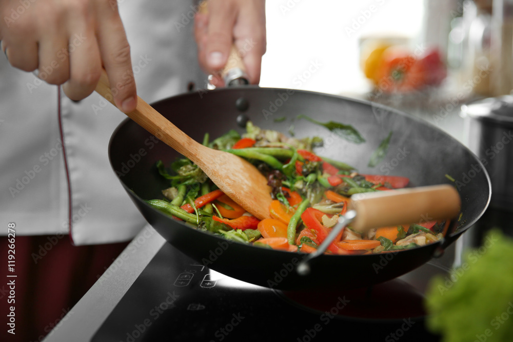 Mixing vegetables in pan closeup Mixing vegetables in pan closeup