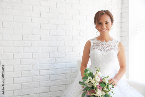 Beautiful bride with weddin...