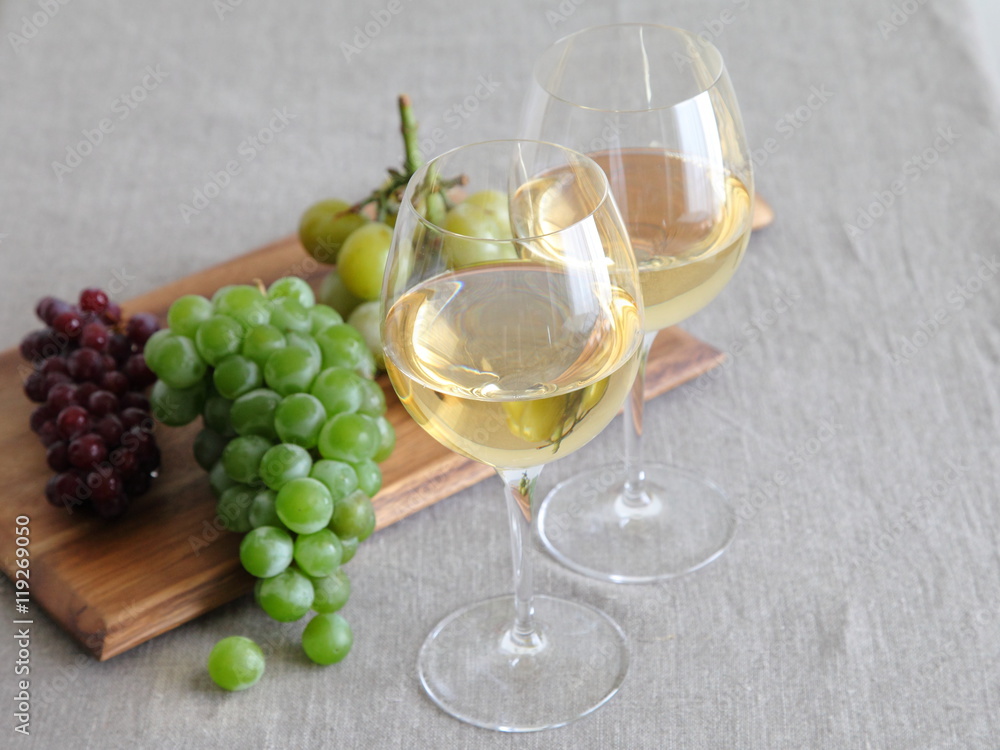 Glasses of wine with grapes on wooden board Glasses of wine with grapes on wooden board
