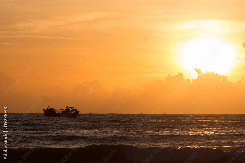 nautical fishing boat in sea with beautiful sky sunrise