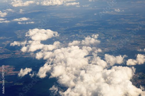 Foto Fluffy clouds over the earth, the landscape