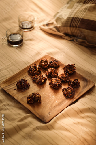 Cookies with the coffee on a wooden surface.