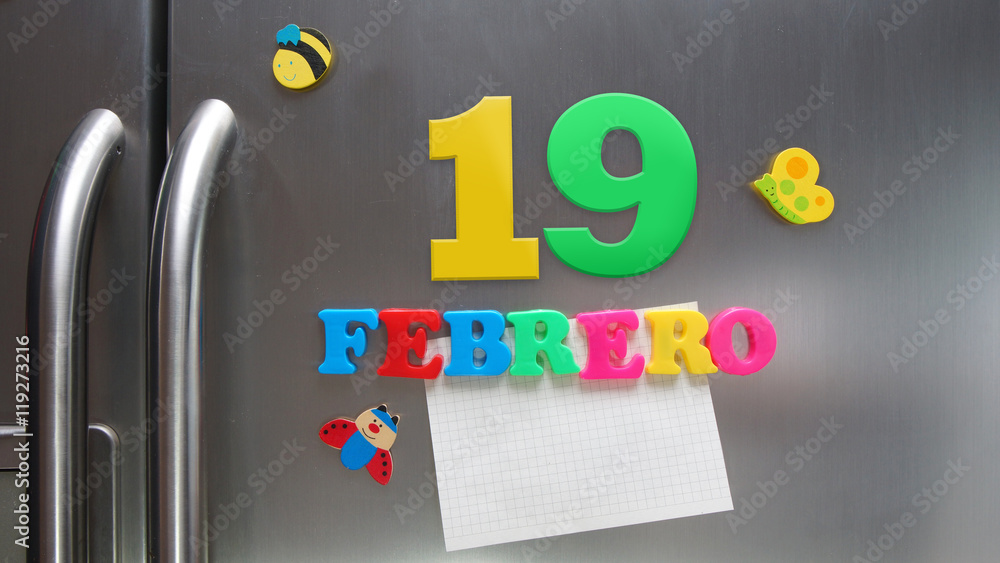 Febrero 19 (February 19 in Spanish language) calendar date made with  plastic magnetic letters holding a note of graph paper on door  refrigerator. Spanish version Stock Photo | Adobe Stock