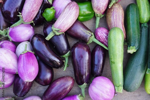 Purple eggplants and colorful summer vegetables