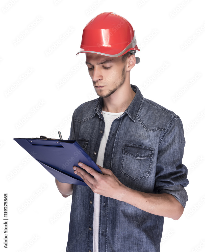 Young man in a construction helmet. Young man in a construction helmet.