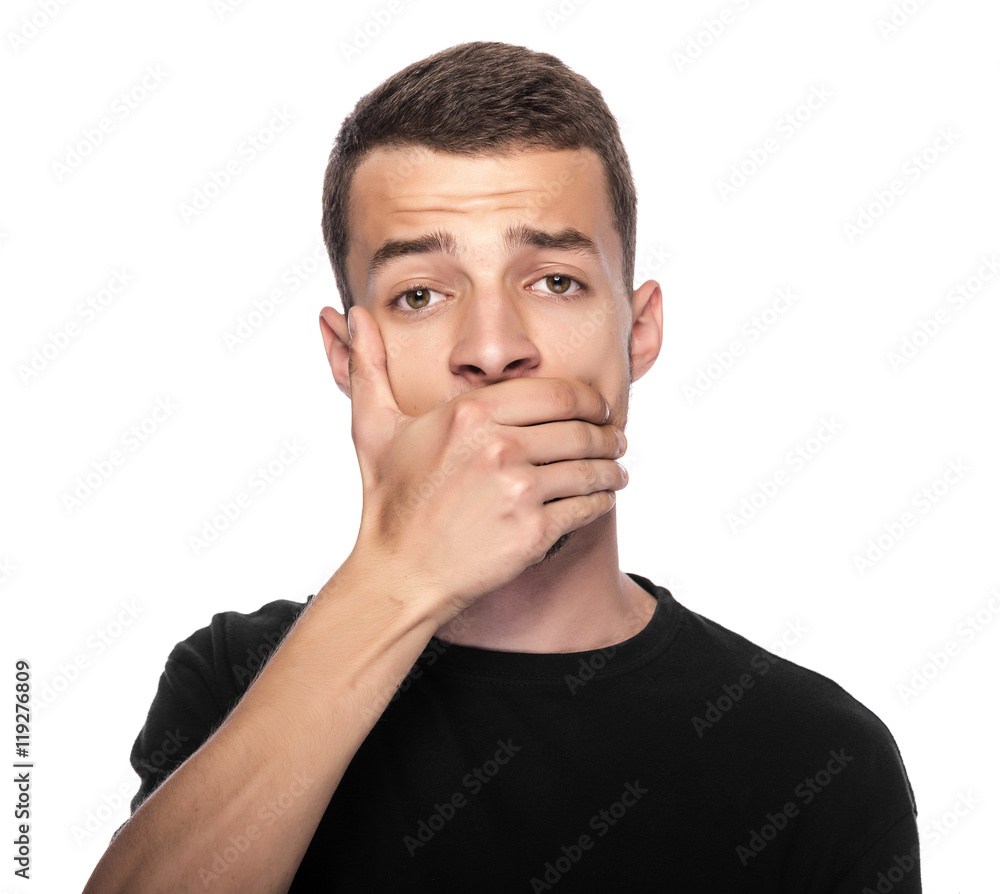 Man with hand covering his mouth. Man with hand covering his mouth.