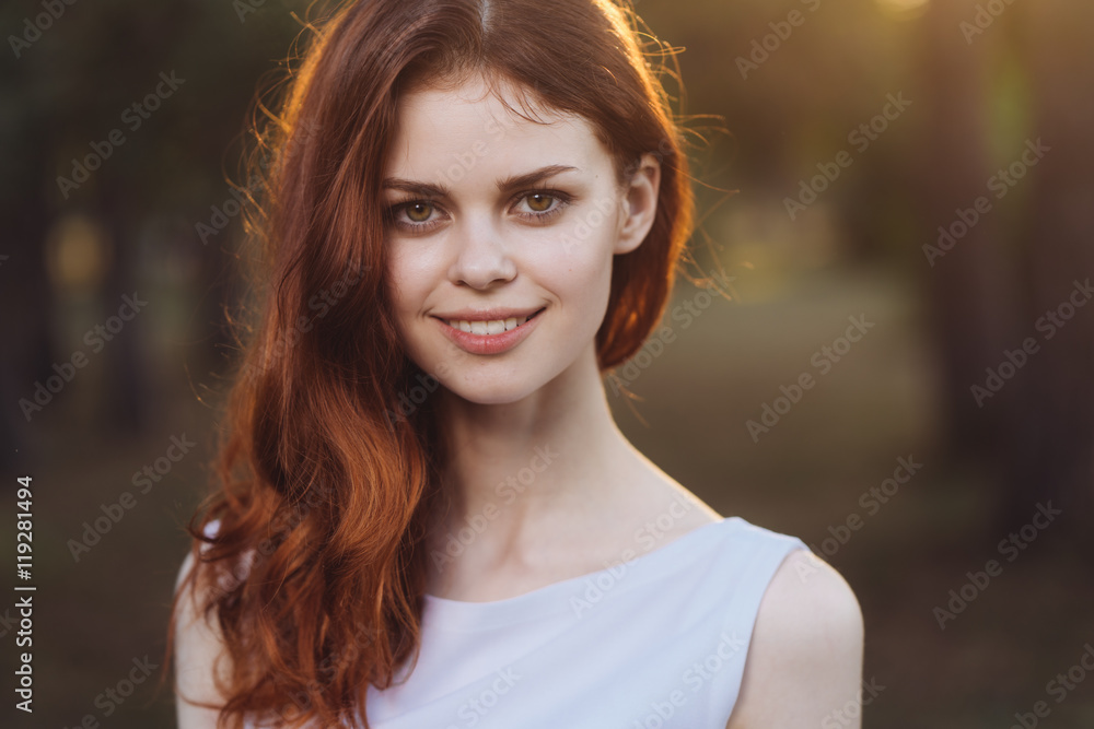 Naklejka premium woman in a white dress park 