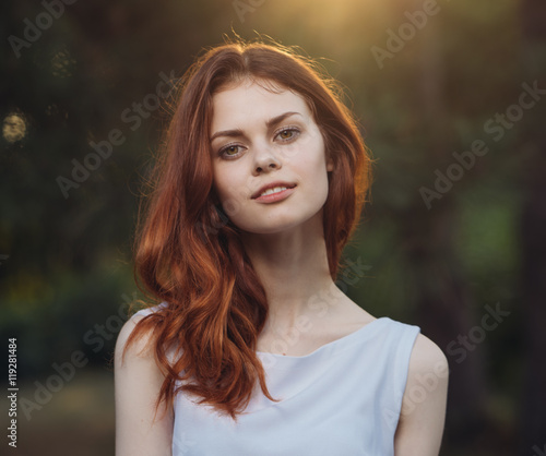 woman in a white dress park
