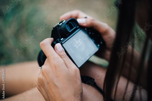 woman with a camera in the hands of a top view