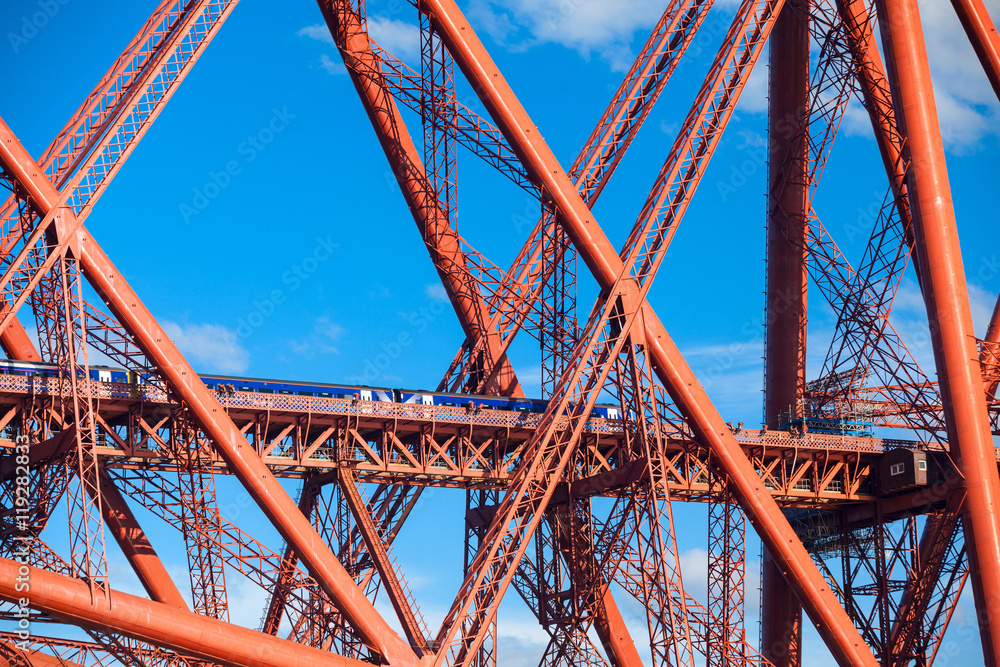 Train crosses the Forth Railway Bridge in Edinburgh, Scotland