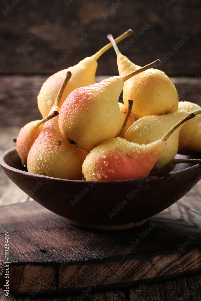 ripe pears on vitage wooden table