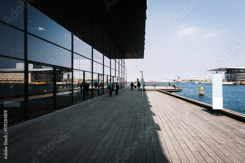 Copenhagen pier with wooden walkway and sea infrastructure at sunny day, Denmark.