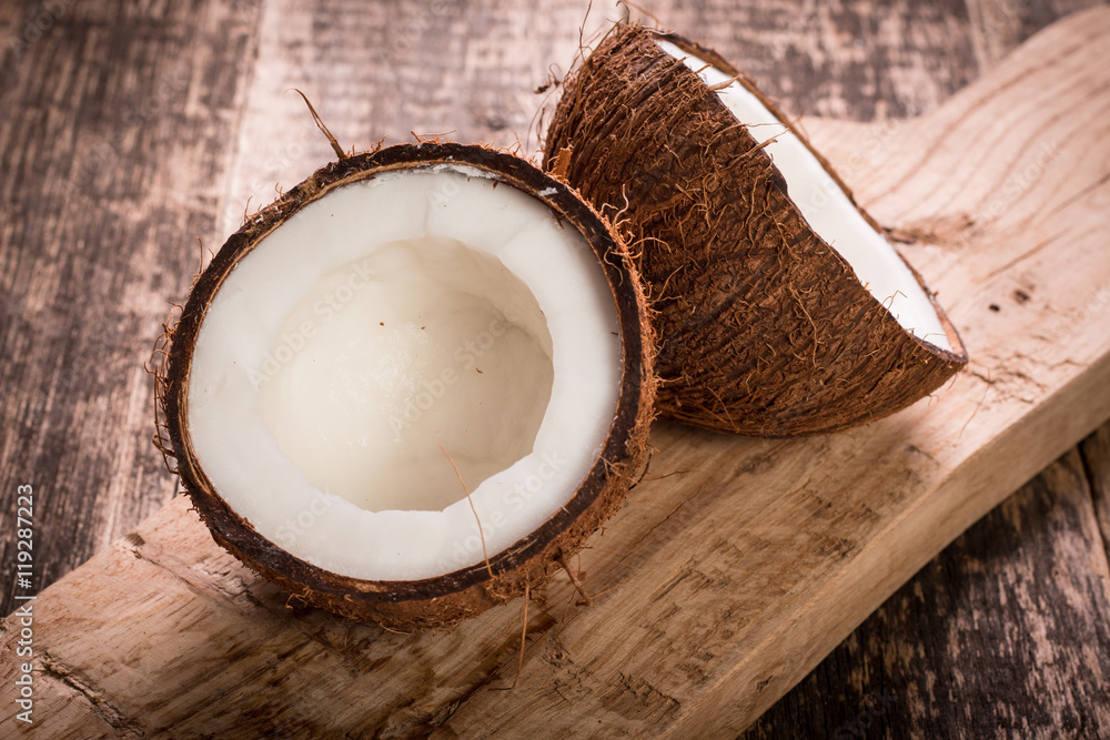 Coconut on wooden table. Coconut on wooden table.