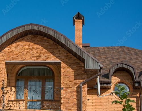 Wallpaper Mural Balcony under the rounded roof with rain gutter, chimney, round windows Torontodigital.ca