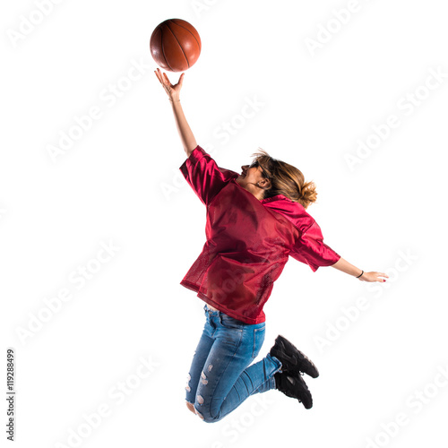 Woman playing basketball © luismolinero