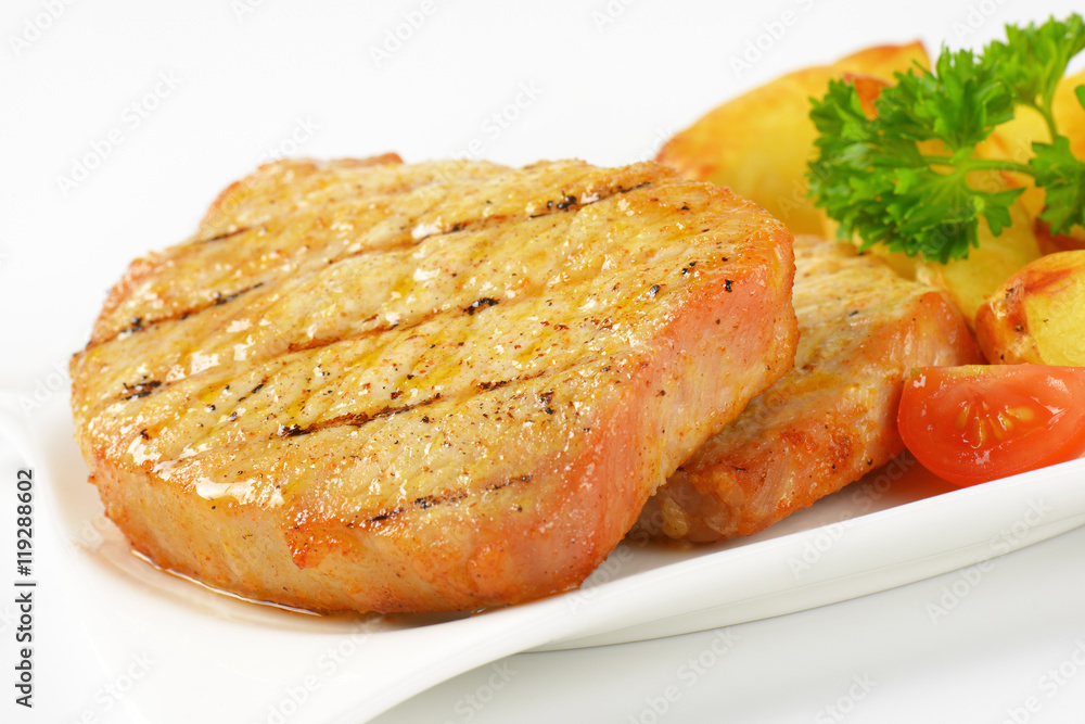 Grilled pork chops with potato wedges