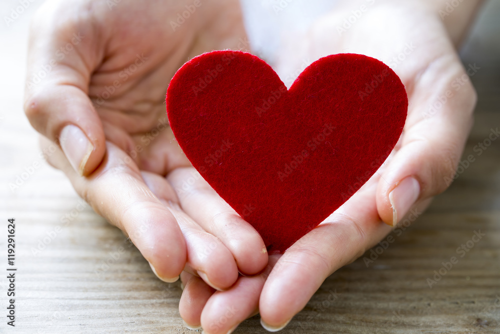Holding Red Heart Holding Red Heart