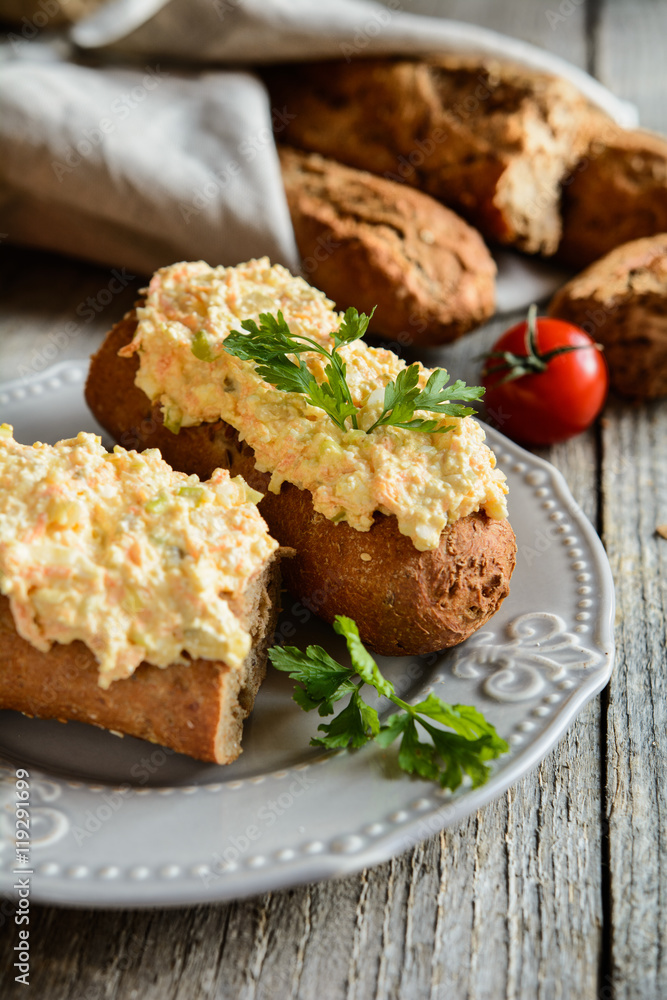 Whole wheat baguette with curd spread, eggs, carrot, green onion, pickled cucumber and mayonnaise Whole wheat baguette with curd spread, eggs, carrot, green onion, pickled cucumber and mayonnaise