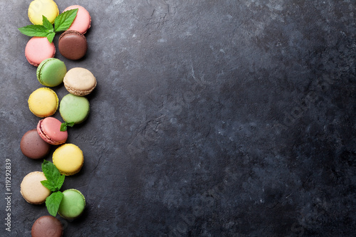 Colorful macaroons on stone table