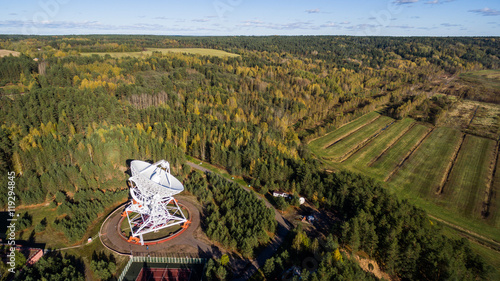 Aerial view radio telescope in forest at countryside in saint-Petersburg Russia photo