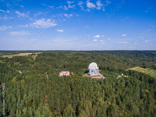 Aerial view radio telescope in forest at countryside in saint-Petersburg Russia photo