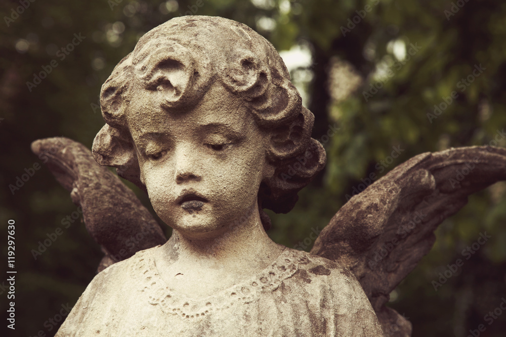 sculpture of an angel with dark background sculpture of an angel with dark background