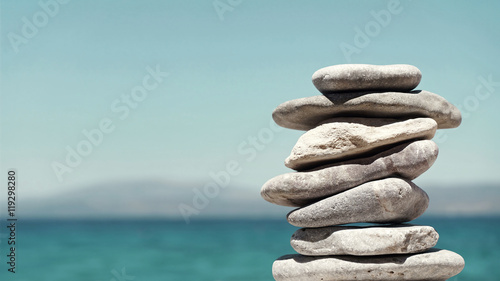 Stack of Sea Pebbles on a Calm Sea Background