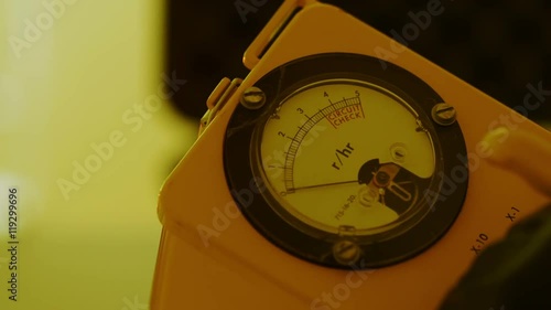 Using a Geiger counter to determine possible radiation levels. photo