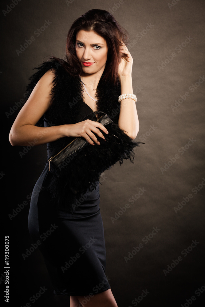 woman evening dress handbag in hand on black woman evening dress handbag in hand on black
