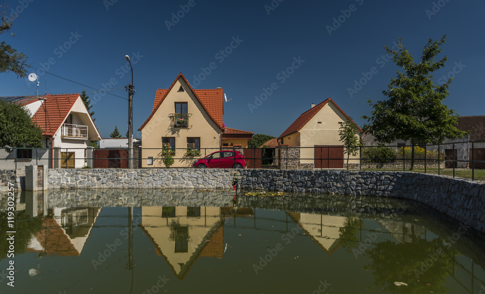 Fototapeta premium Branisov village with pond and houses